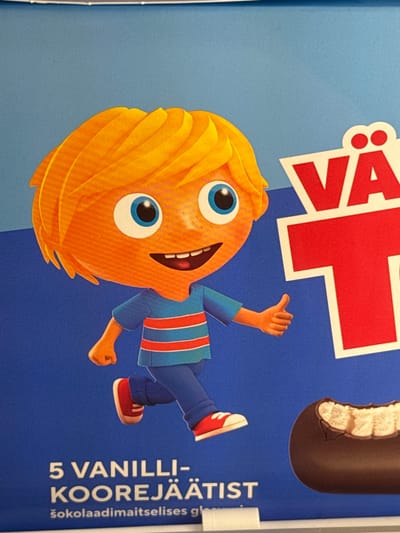 A cartoon boy with orange skin, blonde hair, and blue eyes is depicted on a blue background. He is wearing a blue shirt with red and white stripes and blue pants with red shoes. The boy is running and giving a thumbs-up gesture. To the right of the boy, there is large red text that reads "VÄ". Below the boy and text, there is more text that reads "5 VANILLI-KOOREJÄÄTIST" and then smaller text below that which reads "šokolaadimaitselises gl". On the far right of the image, there is a partial view of a chocolate-covered ice cream bar with a bite taken out of it. The image is a product advertisement, likely for ice cream. There is no indication of the city of Keila, Estonia in the image.