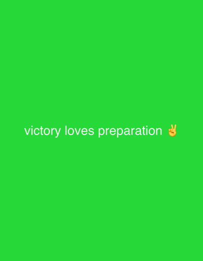The image displays a bright green background with white text that reads "victory loves preparation" on the lower half of the screen. To the right of the text, there is a peach-colored emoji of a hand making the peace sign. The image is centrally focused, with no visible surroundings or environmental context that would indicate a specific location in Wai A, Nigeria.