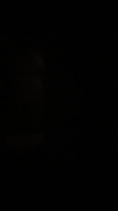 The image is completely black. There are no discernible features, objects, or subjects.  The coordinates (-34.667, -58.733) correspond to a location in Merlo, Argentina.