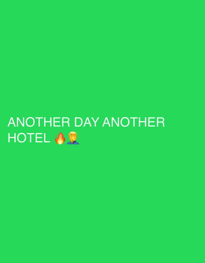 The image displays a digital graphic with a solid, vibrant green background. In the lower-left quadrant, white uppercase text reads "ANOTHER DAY ANOTHER HOTEL". Following the word "HOTEL," a fire emoji (🔥) is present, immediately succeeded by a facepalm emoji (🤦♂️). The image does not depict a physical scene or any discernible elements from a city or location identified as New Forest, United Kingdom; it is solely a static visual composition of text and emojis on a monochromatic field. No individuals, direct actions, or environmental details of a real-world location are present.