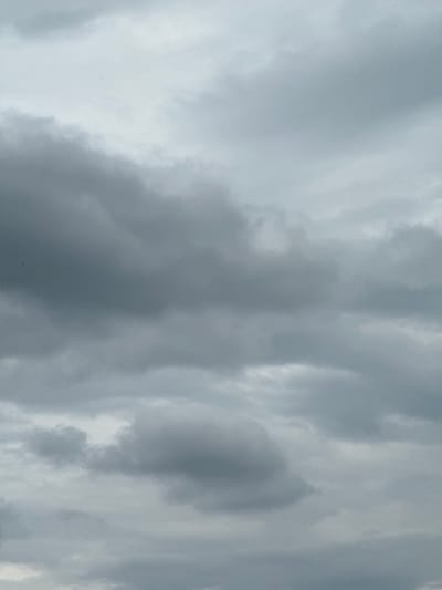The image shows a section of the sky filled with gray and white clouds. The clouds appear dense and layered, indicative of an overcast or stormy weather pattern. The location is Stone Mountain, United States of America.