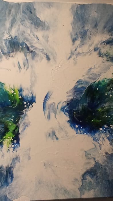 An abstract painting featuring swirling patterns of blue, white, and green. Two darker areas with touches of green are positioned on the top and bottom, resembling land masses. These are separated by a broad expanse of white with wisps of blue and white. The colors blend and flow together, with small white circles scattered throughout the piece.