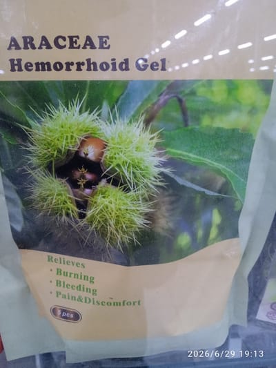 The image displays the packaging for "ARACEAE Hemorrhoid Gel." The packaging features a close-up photograph of a spiky, green chestnut burr with a glimpse of the chestnuts inside. Below the image, text lists benefits of the gel: "Relieves Burning, Bleeding, Pain & Discomfort." It also indicates "5 pcs" and a date stamp "2026/6/29 19:13." The context of Ak-Suu, Kyrgyzstan, is not visually represented in the image.