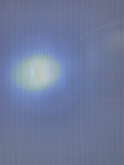 The image displays an abstract pattern composed of numerous closely spaced, thin, parallel vertical lines covering the entire frame. The dominant color scheme is a muted periwinkle or light blue. A horizontally elongated, ovular area of luminescence, primarily yellow-green and white, is centrally positioned within the frame, exhibiting a brighter intensity and more distinct vertical color banding. No discernible geographic features, architectural elements, people, objects, actions, or interactions are present that would allow for the identification of a specific location within the city of Raduil, Bulgaria, or any other specific environment.