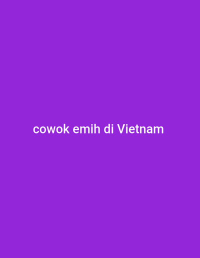 The image displays a solid, uniform purple background. Centered on this purple field is white text, which reads "cowok emih di Vietnam". No people, distinct subjects, physical objects, actions, or interactions are visually depicted within the image frame. The environment consists solely of the monochromatic purple background, serving as a digital display within the city of Koulamoutou, Gabon.
