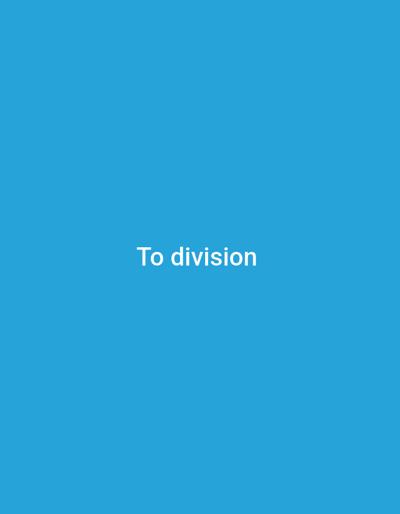 The image is a plain blue screen with white text that reads "To division". The text is centered horizontally and vertically within the frame. There are no other discernible objects, people, or environmental features. The location in the city of Wuro Ngangandi, Nigeria, is not determinable from the image content.