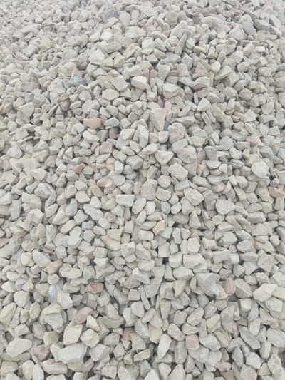 The image shows a pile of light-colored, angular rocks or stones. There are no people or other discernible objects present. The environment is simply a mass of these rocks. There's no indication of the location being Яльгелево, Russia, or any other city.