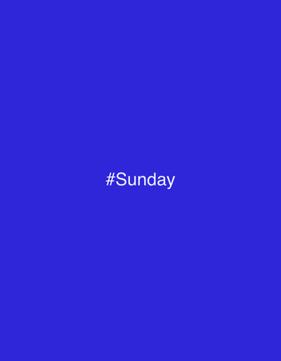 The image displays a digital graphic featuring a solid, uniform royal blue background. Centered on this blue field, white sans-serif text reads "#Sunday". No specific physical location within Pagny-sur-Meuse, France, is discernible from the visual content. There are no people, subjects, objects, actions, or interactions depicted. The environment consists solely of the described color field and text.