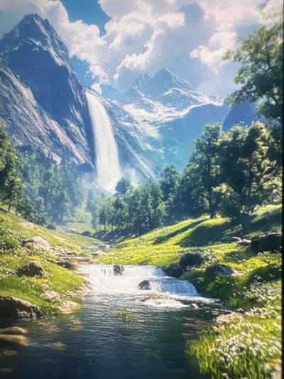 The image depicts a scenic landscape, likely a mountain environment. A prominent mountain range with snow-capped peaks and visible rock formations occupies the left side of the frame, with clouds scattered around the mountain tops. Green trees and vegetation cover a portion of the foreground and mid-ground, possibly extending along a river or stream that flows through the scene on the right. The water appears to be moving, possibly forming small cascades or rapids. The environment seems lush and vibrant with a mix of textures from the rocks, foliage, and water. The lighting suggests daylight, with some areas in shadow and others illuminated by the sun. The presence of white vegetation could indicate wildflowers or snow.

The city of Kukorevo, Bulgaria is not depicted in this scene. The picture appears to be a natural landscape devoid of any visible urban or city-specific elements.