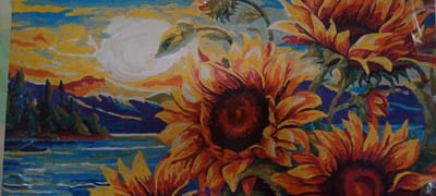 The image is a painting of sunflowers against a backdrop of a sunset over a body of water and mountains. The sunflowers are in the foreground, with large, vibrant petals in shades of yellow, orange, and red. The sky is a mix of yellow, orange, and blue, with a large, pale sun. In the background, there are dark green trees and blue mountains. The water is depicted in shades of blue and white, with reflections of the sky. There are no people or animals visible in the painting. The painting style appears to be somewhat abstract, with bold brushstrokes and a simplified representation of the landscape.
The image does not contain any identifiable landmarks or features that would allow for its location to be determined, including in the city of Kudymkar, Russia.