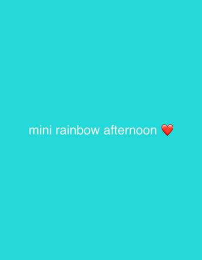 A light teal background displays the text "mini rainbow afternoon" in white, centered horizontally. To the right of the word "afternoon" is a red heart emoji. The composition is simple and clean with a cheerful and positive tone.