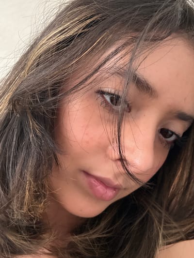 A close-up photograph shows the face of a young person with dark brown hair that has some blonde highlights. The hair is partially covering the face. The person has brown eyes and light skin with some freckles. The location is not discernible from the image. There is no evidence to suggest it was taken in Veracruz City, Mexico.