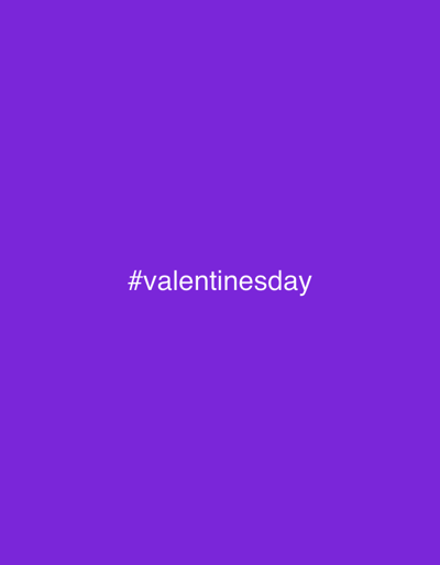 The image features a solid purple background. In the center, the white text "#valentinesday" is prominently displayed. The font appears simple and sans-serif, ensuring readability against the contrasting backdrop. The focus is solely on the hashtag, emphasizing the Valentine's Day theme.