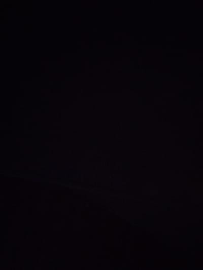 The image depicts a dark, featureless expanse, predominantly black with subtle variations in shade that suggest a lack of direct light. There are no discernible objects, people, or environmental features present. The overall impression is one of complete darkness or an underexposed photograph. There is no visual information that can be used to determine a specific location within the city of Sovetsk, Russia, or any other identifiable setting.