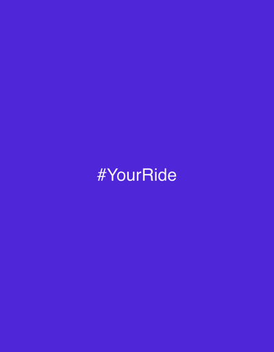 A purple square displays the hashtag "#YourRide" in white, sans-serif font. The text is centered horizontally and vertically, creating a simple, minimalist composition against the solid-colored backdrop. The overall effect is clean and direct, drawing attention to the hashtag as the focal point of the image.