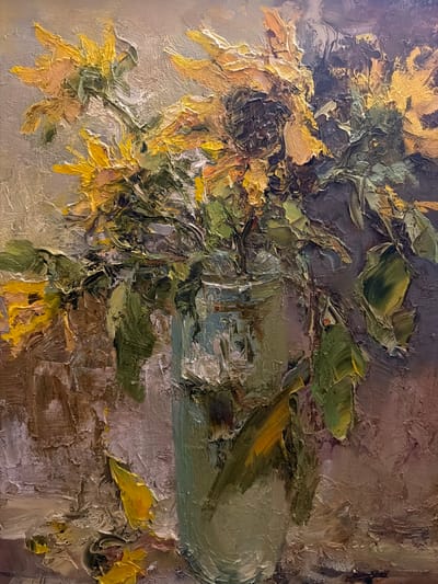 The image is an oil painting depicting a still life of sunflowers in a vase. The sunflowers are rendered with thick, textured brushstrokes, primarily in shades of yellow and green. The vase is indistinct, appearing as a mass of green and grey paint. The background is a muted blend of brown, grey, and green tones. The painting employs an impressionistic style. The location, Levkovo, Russia, is not directly evident within the image itself, making it an external piece of information rather than an intrinsic element of the depicted scene. There are no people in the image, and the subject is limited to the sunflowers, vase, and background. The primary action is the act of displaying the sunflowers in a vase.