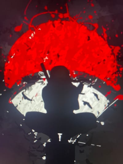 The image shows a silhouette of a person in a meditative pose against a background of a large red, circular design with black splatters. The red design appears to be a stylized sun or a similar celestial body. The person's silhouette is dark and indistinct, with a sword or similar object held behind their head. The overall aesthetic is graphic and dramatic, with high contrast between the dark silhouette, the vibrant red, and the lighter areas of the background which appear to be abstract shapes. The background also contains some black shapes that could be interpreted as birds in flight or other abstract elements. The image is pixelated, suggesting it is a digital display, possibly a screen or a projection. There is no discernible urban environment or specific location in Lancaster, United Kingdom depicted.