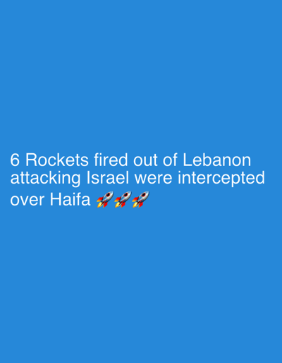 The image, observed from the context of Beit Yitshak Sha'ar Hefer, Israel, displays white text and three rocket emojis on a solid, untextured blue background. The primary subject is white sans-serif text positioned in the lower-left quadrant, stating: "6 Rockets fired out of Lebanon attacking Israel were intercepted over Haifa". Below the word "Haifa," three identical rocket emojis are horizontally aligned. Each rocket is depicted in silver with red and yellow fins, emitting orange and yellow flames from its thruster, and oriented to the left. No people, discernible objects, or environmental features are present beyond these textual and emoji elements. The image communicates information about an aerial event involving rockets over Haifa, Israel.