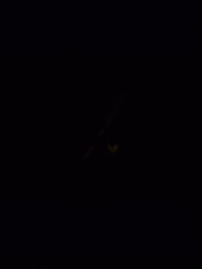 The image shows a dark scene with some faint, illuminated objects in the center. It is impossible to determine the location in Bochum, Germany, or any specific details about people, subjects, objects, actions, interactions, or the environment due to the lack of visible content.