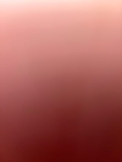 The image displays a gradient of color, transitioning from a pale pink at the top to a deep maroon at the bottom. There are no discernable objects, people, or environmental features present in the image, making it impossible to provide details regarding location or context within Ponebel, Ukraine. The scene is purely abstract and consists only of a color gradation.
