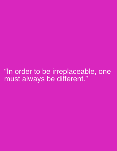 This media file is a square image with a plain, solid magenta background. White text is superimposed over the background, centered horizontally and positioned in the lower portion of the image. The text reads: "“In order to be irreplaceable, one must always be different.”" The quote is attributed to Coco Chanel. There are no other subjects, objects, or details visible in the image. The setting is an abstract digital space, with no discernible location, time of day, or weather. The overall tone is minimalist and focuses solely on the motivational message of the quote.