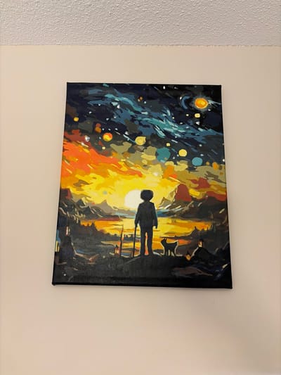 The image is of a painting depicting a silhouette of a person walking under a street lamp. The background is a stylized cityscape with yellow, orange, blue, and dark colors. The painting is hanging on a beige wall. It is not possible to determine the exact location in Woodstock, Canada, as there is no identifying information in the image.