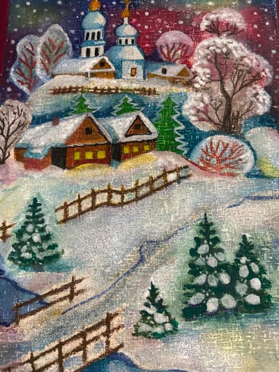 This is a painting of a snowy, winter scene in what appears to be a rural village, possibly inspired by the Ракаўскі сельскі Савет in Belarus. In the background, a cluster of buildings with blue domes and golden crosses suggests a church or monastery. In the mid-ground, two rustic, wooden houses with glowing yellow windows are nestled into a snow-covered hillside. Fences made of simple wooden posts and rails traverse the landscape. Various evergreen trees, dusted with snow, are scattered throughout the scene. The foreground features more fences and trees, with a winding path suggesting a road or trail. The overall impression is one of a peaceful, snow-covered rural setting during winter.