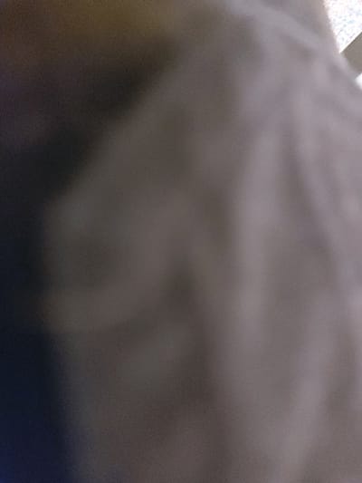 The image is completely out of focus and provides no details about the scene. Therefore, it is impossible to provide a description.
