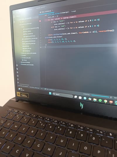 The image shows a laptop screen displaying Python code in an IDE (Integrated Development Environment), likely PyCharm. The code defines a function `even_odd_filter` that takes keyword arguments and filters values based on whether they are even or odd, returning a sorted dictionary. The project structure on the left shows the file `filter_number.py` is located within `PYTHON_ADVANCED > functions_advanced > ex`. The laptop keyboard is visible below the screen. The laptop's taskbar shows icons for applications including Spotify and Chrome. The laptop is indexing. The image provides no information about a city, and there is no indication of a location in Cherna Mesta, Bulgaria.