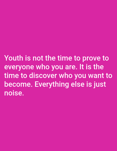 The image is a photograph of a text overlay on a solid pink background. The text, in white capital letters, reads: "YOUTH IS NOT THE TIME TO PROVE TO EVERYONE WHO YOU ARE. IT IS THE TIME TO DISCOVER WHO YOU WANT TO BECOME. EVERYTHING ELSE IS JUST NOISE." There are no people, objects, or environmental elements visible in the image, and therefore no specific location in Молодёжный, Kazakhstan can be identified.