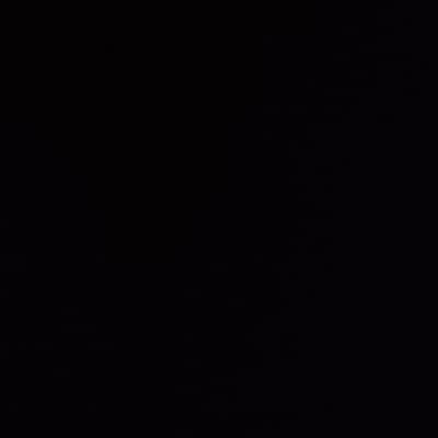 The image is uniformly black, offering no visible shapes, patterns, or discernible features. The darkness is consistent across the entire frame, indicating a complete absence of light or any form of visual information. It's a void, lacking texture or variation.