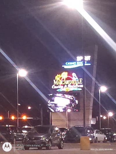 A night shot depicts the illuminated signs of the "Casino del Sol" and "MARGARITAVILLE." The camera phone details read "shot on moto g stylus 5G - 2024" and "Nov 25, 2025, 9:53 PM" on the right side.  Streetlights and parked cars line the background, suggesting a casino parking area.