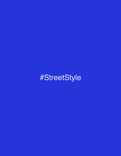 The image is a solid royal blue background with the hashtag "#StreetStyle" centered in white text. The text is simple and clean, with no additional styling or effects. The overall composition is minimalist, drawing attention to the prominent text.