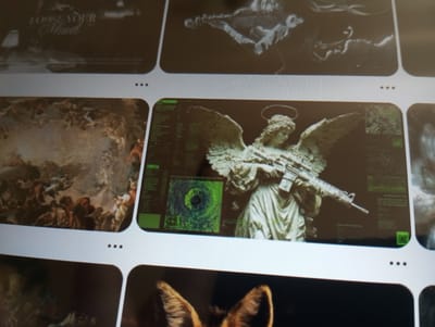 The image displays a grid of various digital images on a screen. In the center of the frame, a notable image features a statue of an angel with a halo, holding a rifle. The statue is superimposed on a background with a green digital interface, including a target-like graphic. To the left of this central image is a section of a painting depicting a crowded scene with multiple figures. Above these are two abstract or artistic images. Below the central image, parts of other images are visible, including what appears to be a close-up of animal ears. The images are arranged in a visually organized manner, suggesting a digital gallery or a screenshot of a webpage. There is no indication of the city of Dymer, Ukraine, or any specific geographical location within the image content itself.
