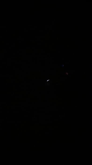 The image is a completely black screen. The coordinates provided, -34.667 latitude and -58.733 longitude, locate a region within the city of Merlo, Argentina.  The image does not depict any people, subjects, objects, actions, interactions, or the environment.