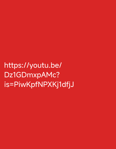 A plain red background fills the frame of this image. White text is displayed across the center of the image, appearing as a URL. The text is left-aligned and stacked in three lines. The first line reads "https://youtu.be/", the second line reads "Dz1GDmxpAMc?", and the third line reads "is=PiwKpfNPXKJ1dfjJ". The text is in a sans-serif font and is uniformly spaced.