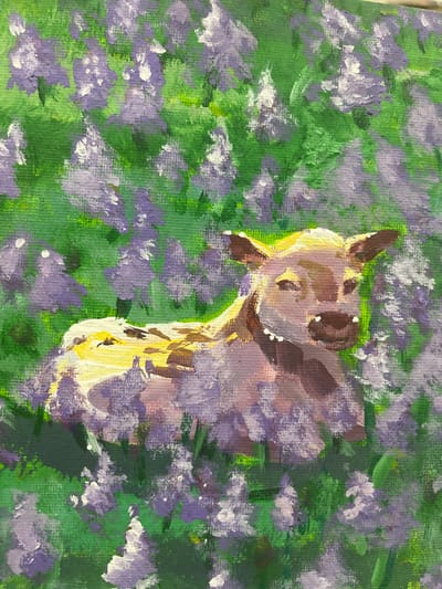 This is a close-up, vertical, eye-level oil painting on canvas of a young calf lying in a field of purple flowers and green foliage. The calf, which is light brown with white markings on its legs and chest, is facing slightly to the right and looking towards the viewer with its eyes closed or nearly closed. Its ears are perked up, and its snout is a darker brown. Small white dots are painted on its muzzle, suggesting dew or pollen. The calf's body is partially obscured by the surrounding flowers, which are depicted with dabs of purple and white paint against a vibrant green background. The brushstrokes are visible, giving the painting a textured and somewhat impressionistic feel. The lighting suggests a bright, sunny day, with yellow and white highlights on the calf's fur. The setting is a natural outdoor environment, likely a meadow or field, filled with blooming flora. There are no recognizable landmarks or structures to suggest a specific location within the city of Nachalovo, Russia. The image focuses solely on the calf and its immediate floral surroundings.