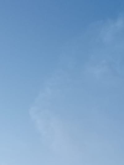 The image shows a clear blue sky with a few wispy clouds. There is no visible evidence of any buildings, people, or objects within the frame. The image is a photograph of the sky, and no specific location in Yampil, Ukraine, can be determined from the visual information provided.