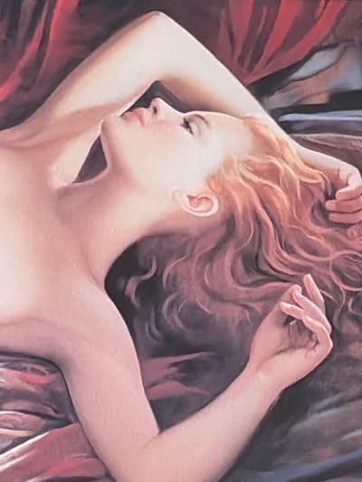 The image is a close-up oil painting of a woman lying down, her head tilted back and eyes closed. She has long, wavy auburn hair that spreads across the dark, textured background, which appears to be fabric. Her left arm is bent at the elbow, with her hand resting behind her head. Her right arm is also bent, with her hand resting near her chest. The woman's skin tone is pale and rendered with soft brushstrokes, highlighting the curves of her body and face. The lighting is soft and diffused, casting gentle shadows and emphasizing the subtle blush on her cheeks. The overall mood of the painting is serene and intimate. There is no visible indication of a specific location in Lyambir', Russia, as the image focuses solely on the portrait of the woman.