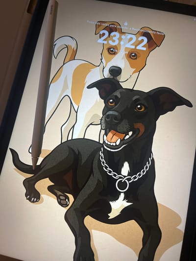 The image shows a digital tablet displaying a lock screen with a cartoon illustration of two dogs. The dog in the foreground is black with brown markings and a silver chain collar. The dog in the background is white with tan patches and has its tail raised. The time displayed on the screen is 23:22, and the date reads "Vie, 12 jun". A stylus pen, identified by the "HUAWEI" branding, rests vertically on the left side of the screen, partially obscuring the background dog. The background is a plain, light tan color. The image captures the screen of the tablet at an angle. There is no indication of the city of Figueres, Spain, in the image or its content.