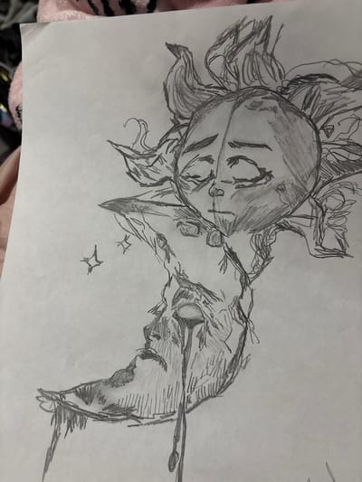 A pencil sketch on paper depicts an anthropomorphic sun and moon. The sun, with a circular face and fiery rays, is positioned above and to the right of the moon. The moon has a crescent shape and a sorrowful face with tears streaming down. Two small star-like shapes are drawn to the left of the moon. The drawing is on a sheet of paper, which appears to be laid on a pink and black fuzzy fabric. There is no discernible location in the city of Gaylord, United States of America.