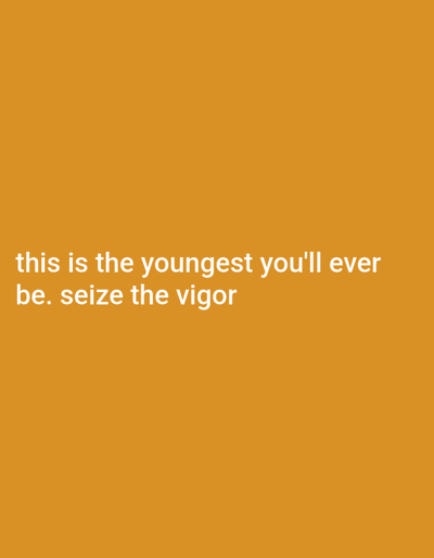 The image depicts a solid yellow background with the text "this is the youngest you'll ever be. seize the vigor" in white font centered on the bottom of the image. The coordinates provided, 39.938, -83.067, correspond to a location in the city of Columbus, Ohio. However, the image itself provides no information about location or context.