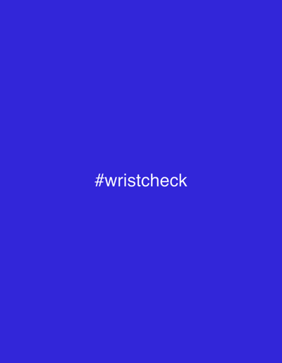 The image is a solid royal blue background with the white text "#wristcheck" centered horizontally and vertically on the screen. There is no discernible location in the city of Fürstenfeldbruck, Germany, or any other discernible environmental details. There are no people, subjects, objects, actions, or interactions depicted.