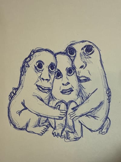 The image is a pen sketch on a light-colored background. It depicts three crudely drawn figures in a close embrace, huddled together. Each figure has a distinct face with large, wide eyes and a mouth. The figures appear to be interconnected and supporting one another. The sketch is in a blue ink. There is no discernible urban environment or specific location, including Drozhzhino, Russia, within the image.
