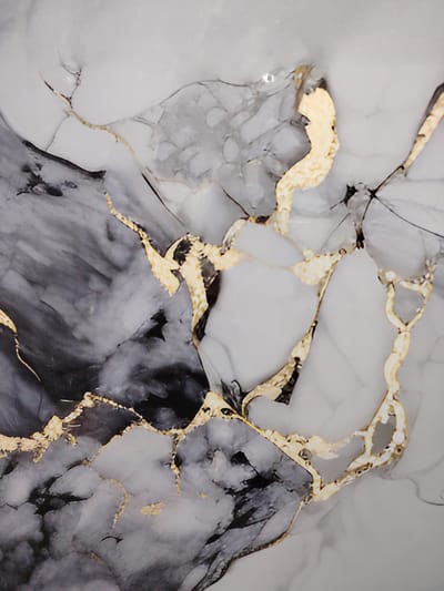 The image displays a close-up view of a marble-like surface with prominent veins of gold and dark gray. The pattern is abstract and resembles natural stone with irregular, branching lines. There are no people, objects, or environmental features that would indicate a specific location in the city of Pitnak, Uzbekistan.