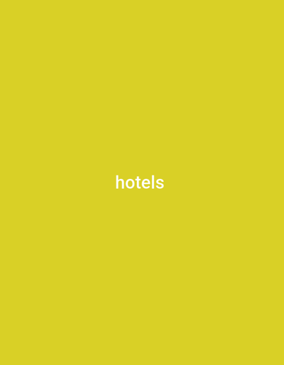 The image is a solid, bright yellow background with the word "hotels" written in white text in the center. There are no people, objects, actions, or interactions visible. The location in the city of Wuro Sani, Nigeria, is irrelevant to the content of the image.