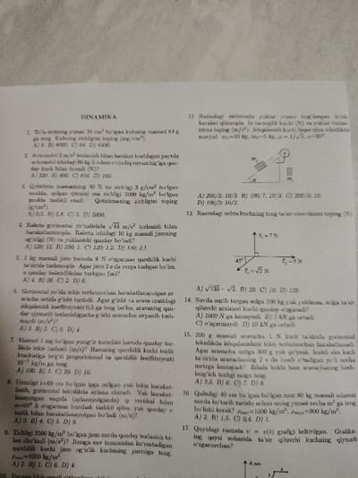 This image displays a white sheet of paper presenting an academic test or assignment focused on physics, specifically "DINAMIKA." (Dynamics). The document contains seventeen numbered problems, many of which include multiple-choice options. Visible diagrams illustrate specific scenarios: a pulley system with two masses (m1, m2) on an inclined plane, a force vector diagram showing three forces (F1, F2, F3) with defined magnitudes and angles, and a velocity-time (v-t) graph. The text is printed in Uzbek. The paper exhibits minor creasing consistent with handling. No individuals, direct actions, or interactions are depicted within the image. This document is located in the city of Kungrad, Uzbekistan.