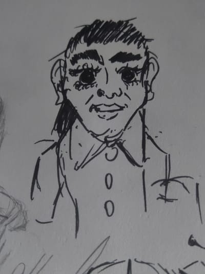 The image is a black and white pen drawing of a person on a white paper background. The person is drawn in a simple, cartoon-like style with exaggerated features, including large eyes and a wide mouth. They have short, messy hair and appear to be wearing a shirt with buttons drawn as circles. The drawing appears to be incomplete, and it is unclear if it was done in Yoksolovo, Russia, as the coordinates provided correspond to a location in the countryside outside of the city.