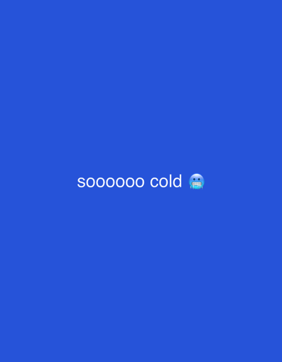 The image displays a uniform royal blue background. Centered horizontally, slightly above the vertical midpoint, is white text that reads "sooooooo cold". To the immediate right of the text, a blue-faced emoji with chattering teeth and icicles hanging from its chin is present. There are no discernible people, subjects, objects other than the text and emoji, actions, or interactions depicted. The environment is abstract, consisting solely of the blue color field. No specific location within the city of Bursa, Turkey, or any geographical area, can be identified from the visual content.