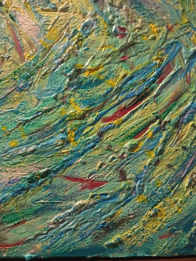 The image is a close-up, textured photograph of an abstract painting. The painting features thick, impasto brushstrokes in various shades of green, blue, yellow, and red. The texture is highly pronounced, with raised ridges and valleys of paint. There are no people or recognizable objects present in the image. The location in the city of Чэрвеньскі сельскі Савет, Belarus, is not determinable from the image itself.